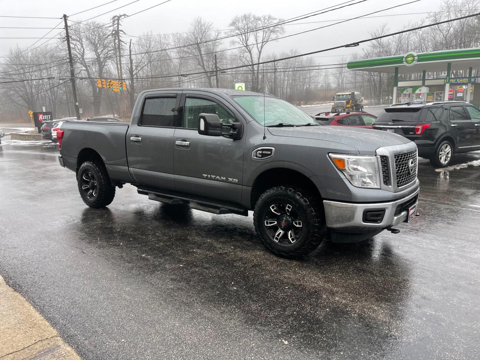 2017 Silver /Black Nissan Titan XD SV 4WD Diesel (1N6BA1F33HN) with an 5.0L V8 DOHC 32V DIESEL engine, 6A transmission, located at 11115 Chardon Rd. , Chardon, OH, 44024, (440) 214-9705, 41.580246, -81.241943 - This 2017 Nissan Titan XD SV Crew Cab featuring the 5.0 Cummins V8 diesel engine and a 6-speed Aisin transmission is a robust full-size pickup truck designed for heavy-duty tasks. As a one-owner vehicle, it suggests a potentially well-maintained history, and with a significant towing capacity of 12, - Photo #3